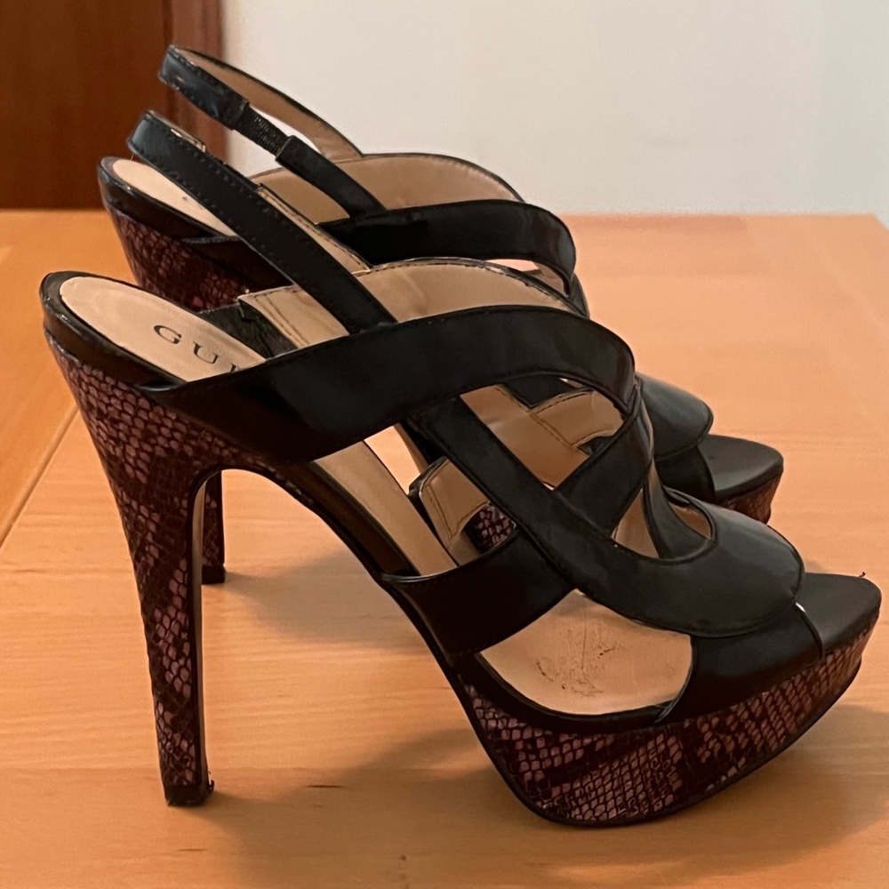 Size 8 Guess heels with crocodile pattern bottom.